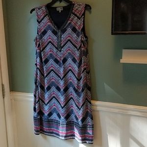 Sleeveless dress with glass bead details.